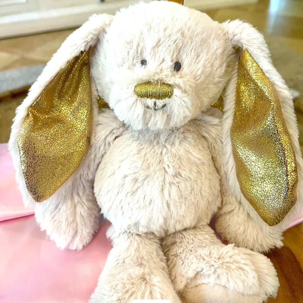 Demdaco Bunny Plush Guardian Angel, a soft, beige stuffed animal .